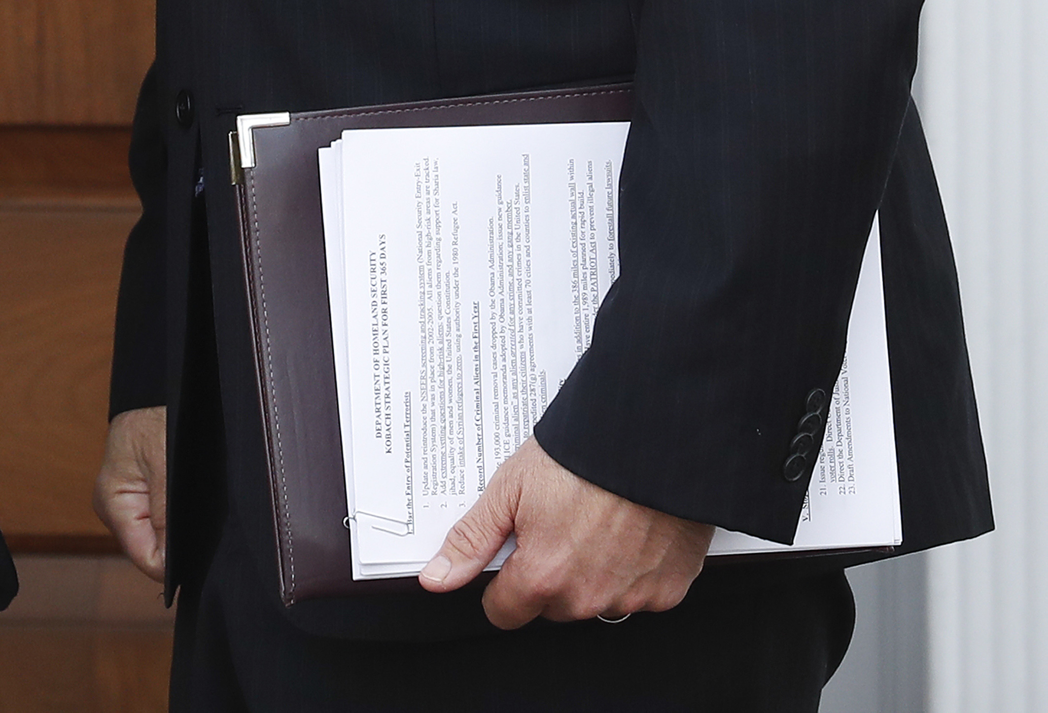 PHOTO: In this Nov. 20, 2016, photo, Kansas Secretary of State Kris Kobach holds a stack of papers as he prepares to meet with President-elect Donald Trump at the Trump National Golf Club Bedminster clubhouse, Nov. 20, 2016, in Bedminster, New Jersey.