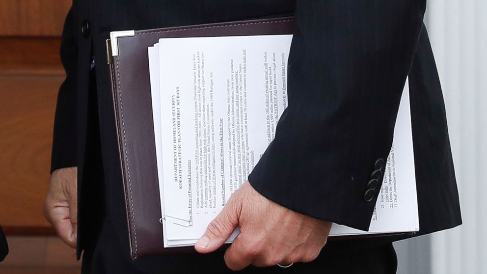 PHOTO: In this Nov. 20, 2016, photo, Kansas Secretary of State Kris Kobach holds a stack of papers as he prepares to meet with President-elect Donald Trump at the Trump National Golf Club Bedminster clubhouse, Nov. 20, 2016, in Bedminster, New Jersey.