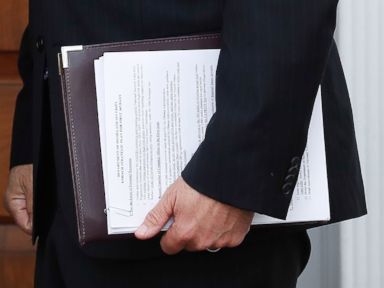 PHOTO: In this Nov. 20, 2016, photo, Kansas Secretary of State Kris Kobach holds a stack of papers as he prepares to meet with President-elect Donald Trump at the Trump National Golf Club Bedminster clubhouse, Nov. 20, 2016, in Bedminster, New Jersey.