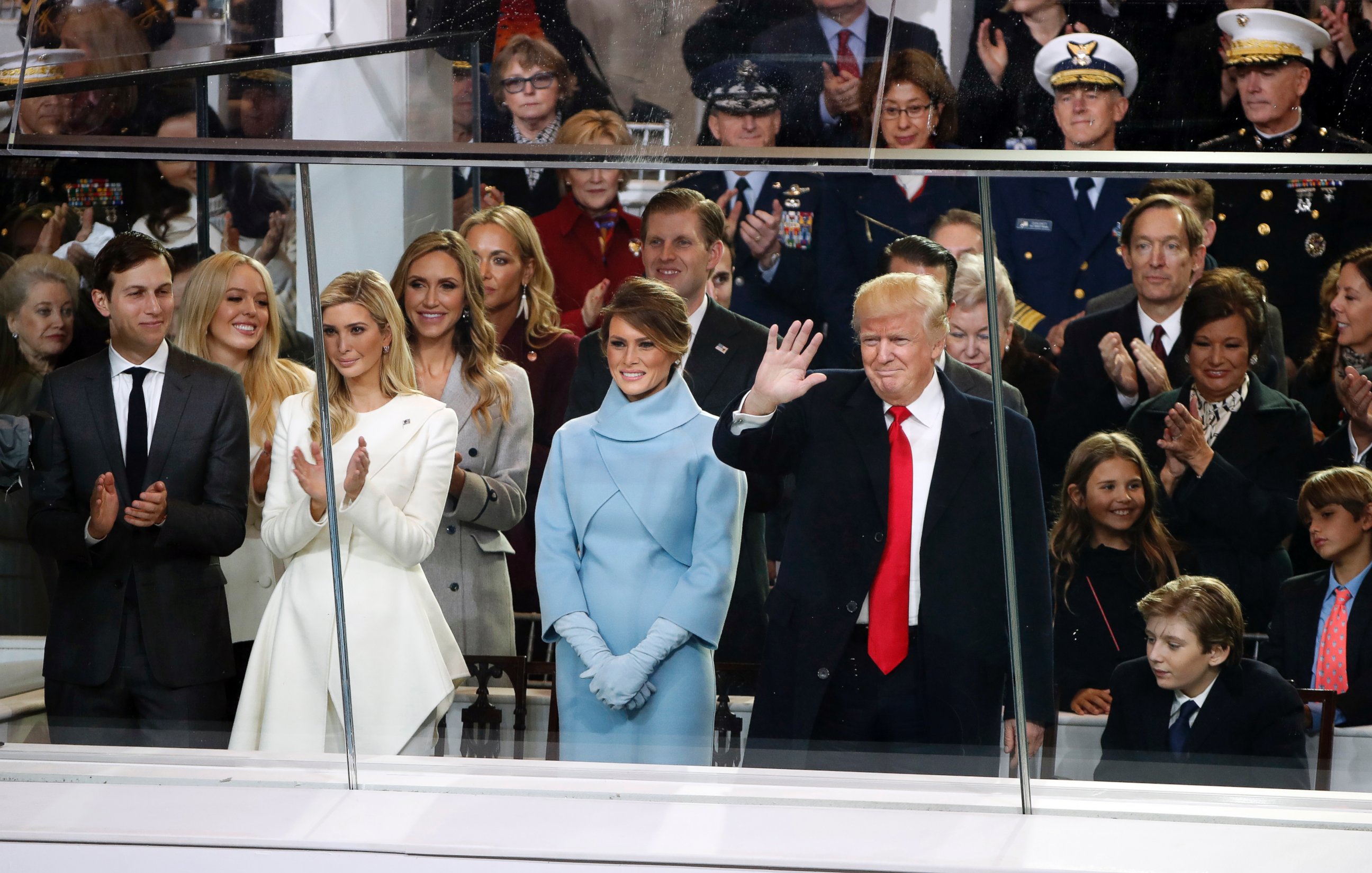 PHOTO: President Donald Trump waves as he is joined by First Lady Melania Trump and his family to view the presidential inauguration parade in Washington, Jan. 20, 2017.