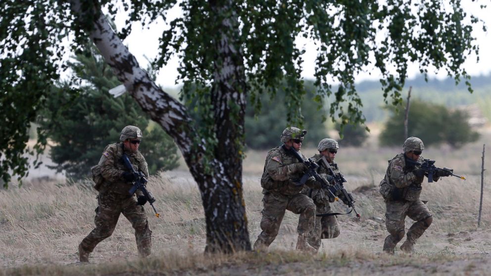 Members of the U.S. Army 173rd Airborne Brigade practice during the combined Lithuanian-U.S. training exercise at the Gaiziunai Training Area west of the capital Vilnius, Tuesday, July 7, 2015. 