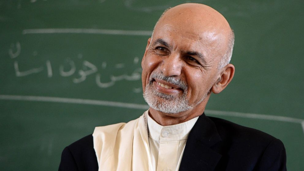 Afghan President Ashraf Ghani Ahmadzai interacts with students during his visit to the Amani High School in Kabul, Sept. 30, 2014. 