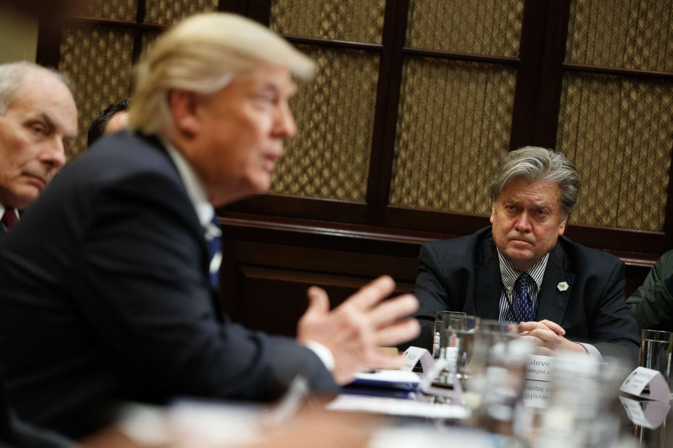 PHOTO: White House Chief Strategist Steve Bannon listens at right as President Donald Trump speaks during a meeting on cyber security in the Roosevelt Room of the White House in Washington,  Jan. 31, 2017. 
