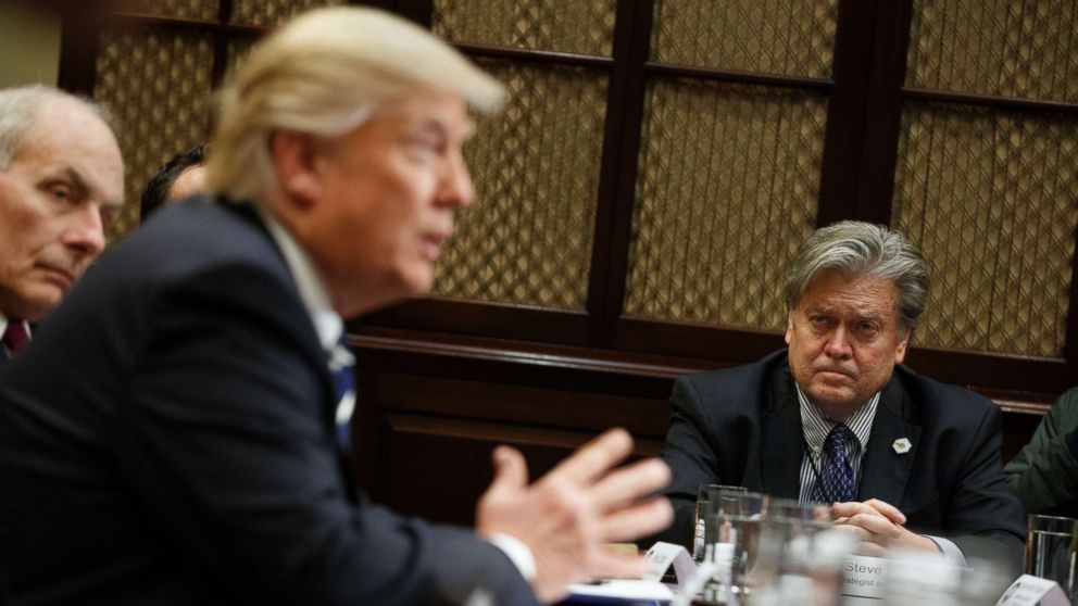 PHOTO: White House Chief Strategist Steve Bannon listens at right as President Donald Trump speaks during a meeting on cyber security in the Roosevelt Room of the White House in Washington,  Jan. 31, 2017. 