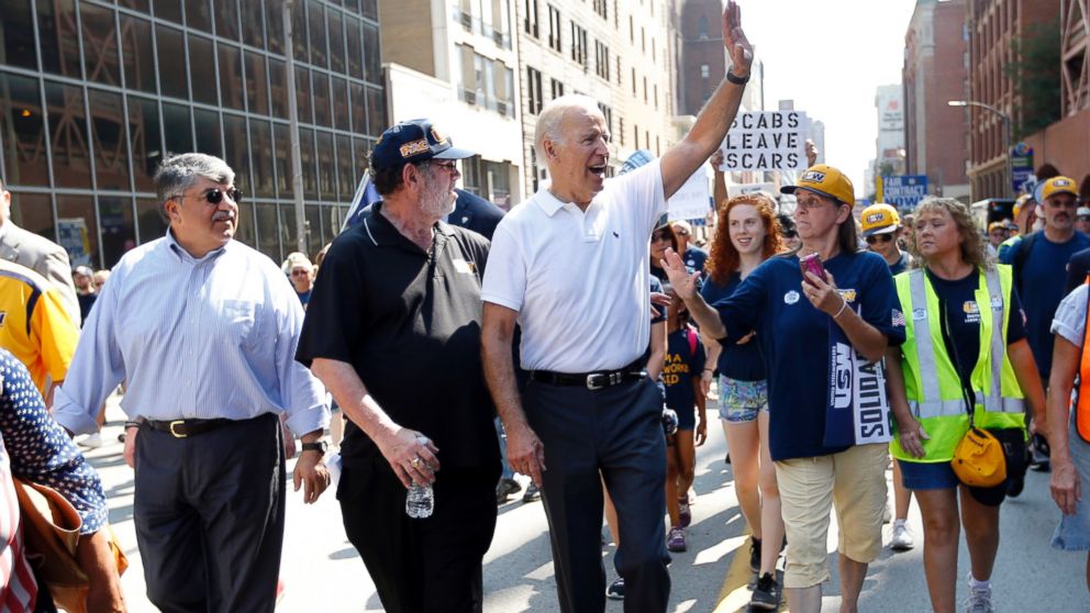 PHOTO: Vice President Joe Biden, center, walks with United Steelworkers President Leo Gerard, center left, and AFL-CIO President Rich Trumka, left, as he joins joins in the annual Labor Day parade on Sept. 7, 2015, in Pittsburgh. 