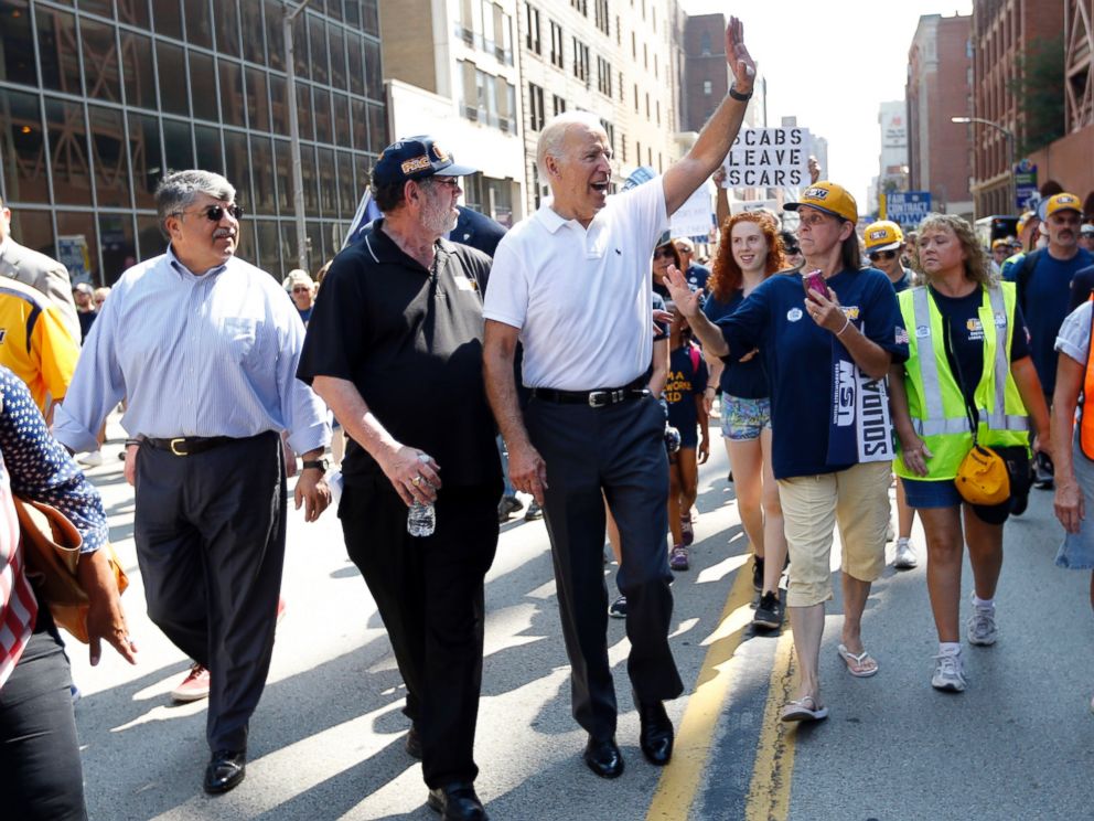 PHOTO: Vice President Joe Biden, center, walks with United Steelworkers President Leo Gerard, center left, and AFL-CIO President Rich Trumka, left, as he joins joins in the annual Labor Day parade on Sept. 7, 2015, in Pittsburgh.