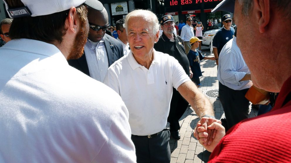 Vice President Joe Biden, center, greets some of the crowd as he walks in the annual Labor Day parade on Sept. 7, 2015, in Pittsburgh.