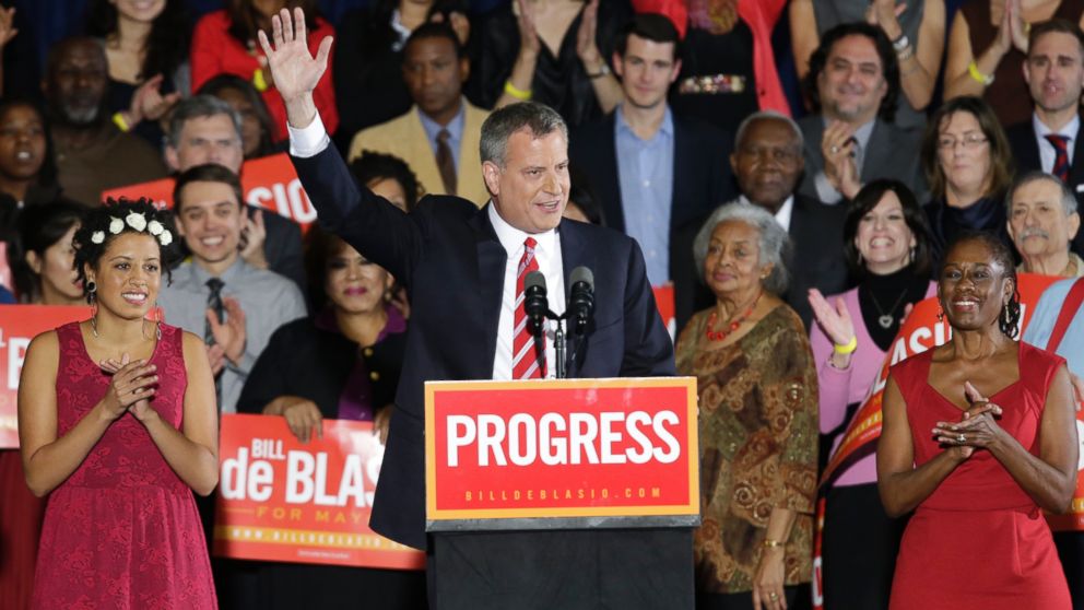 Democratic Mayor-elect Bill de Blasio, flanked by daughter Chiara, left, and wife Chirlane, waves from the stage after he was elected the first Democratic mayor of New York City in 20 years in the Brooklyn borough of New York on Nov. 5, 2013.   