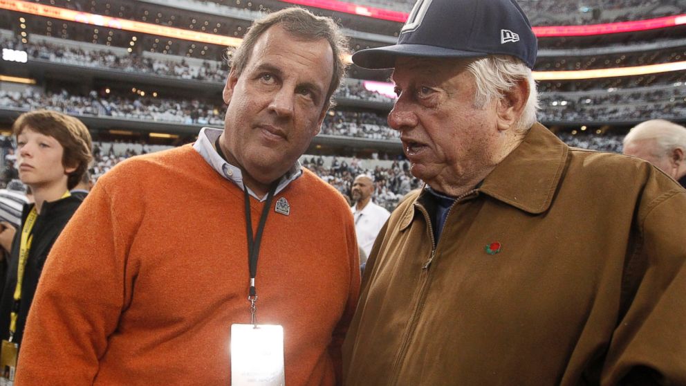 New Jersey Governor Chris Christie and former Los Angeles Dodgers manager Tommy Lasorda talk on the sideline before an NFL wildcard playoff football game between the Dallas Cowboys and the Detroit Lions in Arlington, Texas, Jan. 4, 2015.