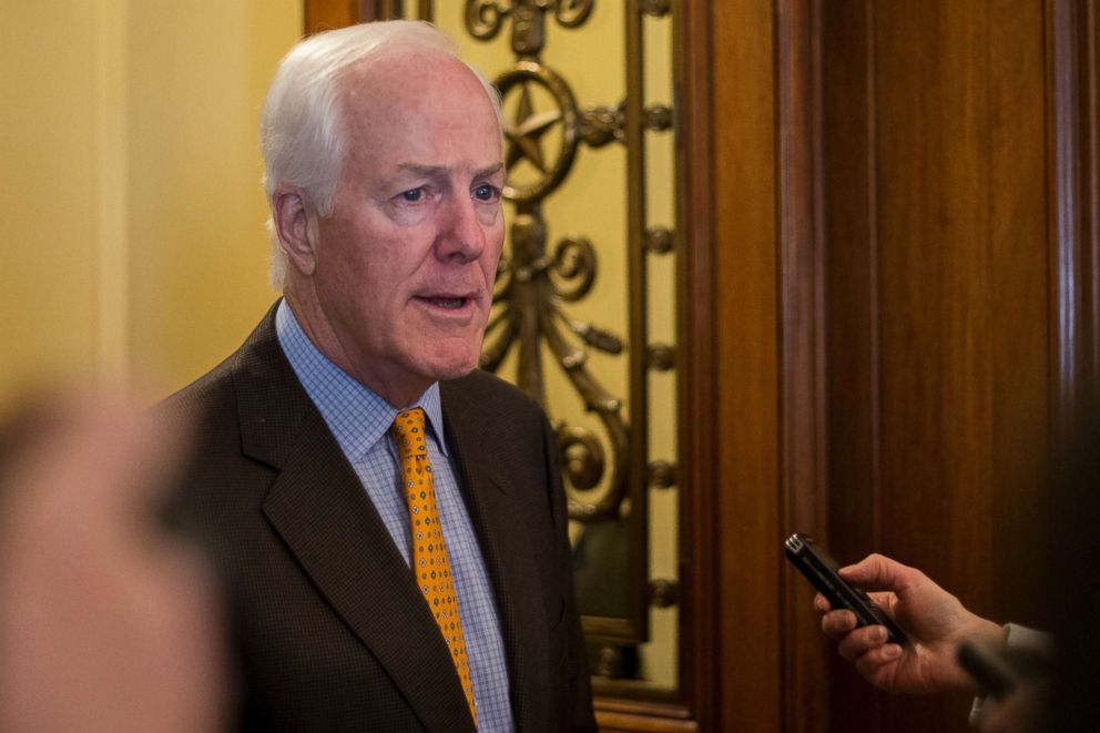 PHOTO: Senator John Cornyn talks with reporters outside the Senate Chamber in the United States Capitol Building in Washington, D.C., Jan. 19, 2018.