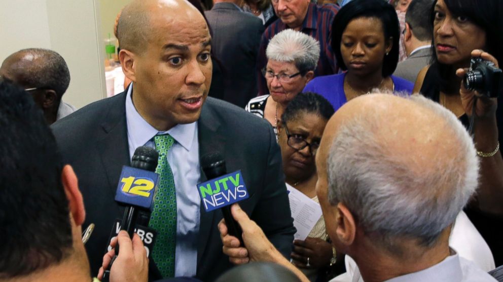 Senator Cory Booker, left, D-N.J., answers to a question at a gathering in Union, N.J., July 27, 2015.