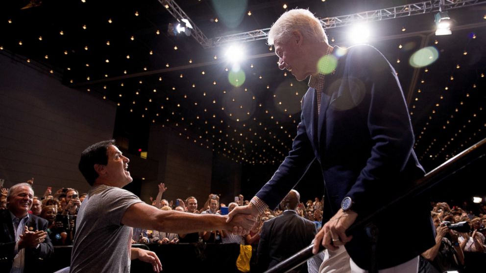 Dallas Mavericks owner Mark Cuban, left, shakes hands with former President Bill Clinton during a rally for Democratic presidential candidate Hillary Clinton at David L. Lawrence Convention in Pittsburgh, Saturday, July 30, 2016.