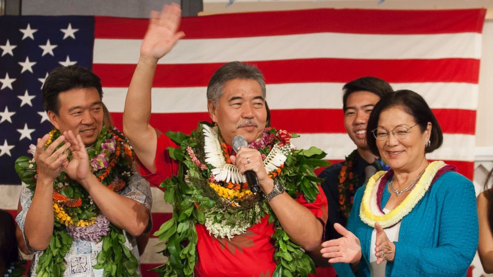 Hawaii Governor-elect David Ige, center, waves between Lt. Gov. Shan Tsutsui, left, and U.S. Rep. Maize Hirono at the Democratic Coordinated Election Night Celebration at the Japanese Cultural Center of Hawaii in Honolulu, in this Nov. 4, 2014 file photo.