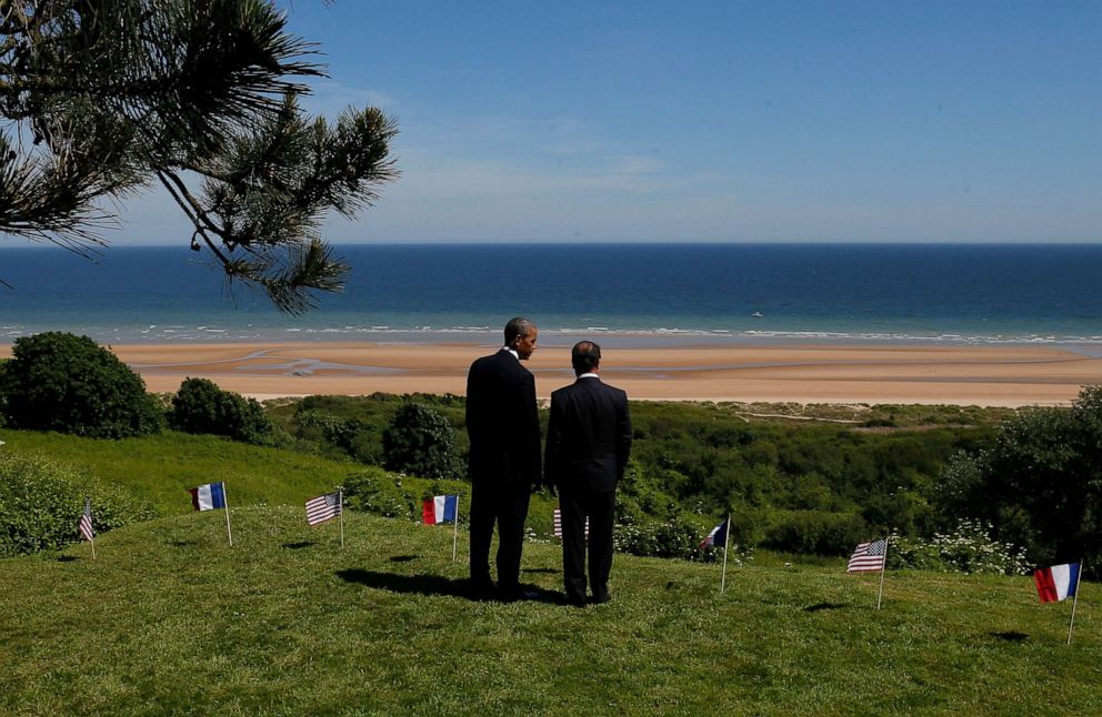 PHOTO: President Barack Obama and French President Francois Hollande look out at Omaha Beach at Normandy American Cemetery as they participate in the 70th anniversary of D-Day in Colleville sur Mer in Normandy, France, June 6, 2014. 