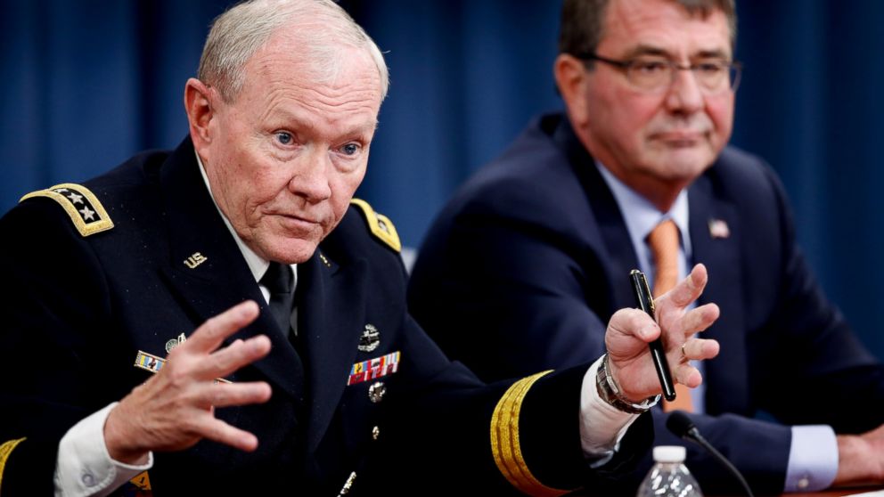 PHOTO: Joint Chiefs Chairman Gen. Martin Dempsey, left, accompanied by Defense Secretary Ash Carter, right, speaks during a news conference at the Pentagon, April 16, 2015. 