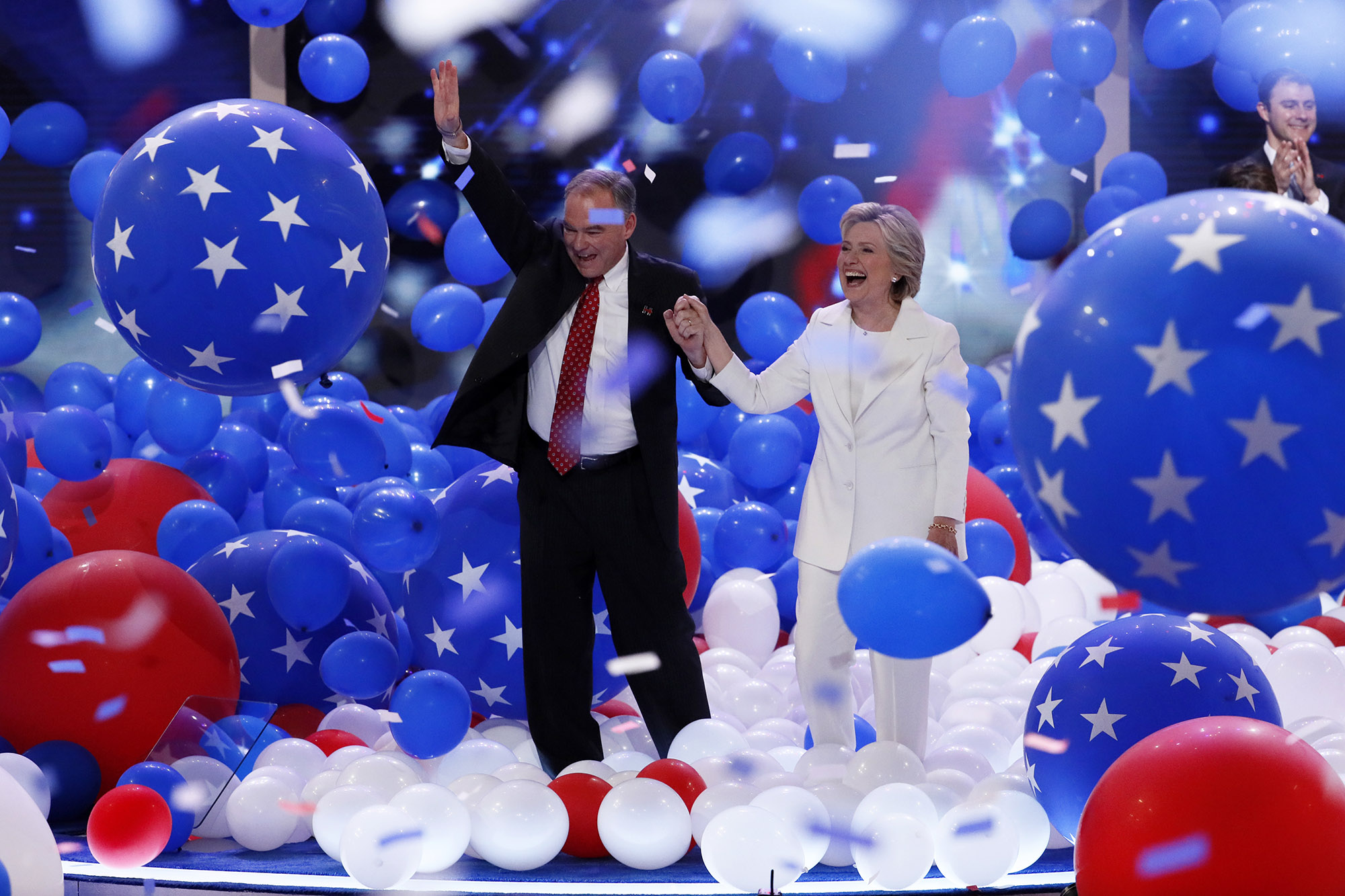 PHOTO: Democratic presidential nominee Hillary Clinton and Democratic vice presidential nominee Sen. Tim Kaine, walk through the falling balloons during the final day of the Democratic National Convention in Philadelphia, July 28, 2016.