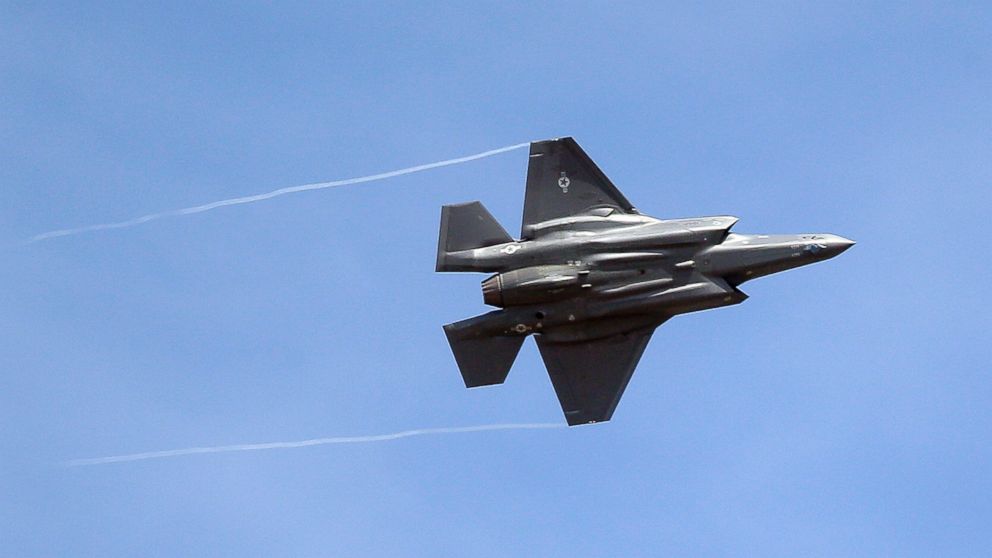 FILE - In this Wednesday, Sept. 2, 2015, file photo, an F-35 jet arrives at its new operational base at Hill Air Force Base, in northern Utah. Shares of Lockheed Martin fell Monday, Dec. 12, 2016, as President-elect Donald Trump tweeted that making F-35 fighter planes is too costly and that he will cut "billions" in costs for military purchases. 