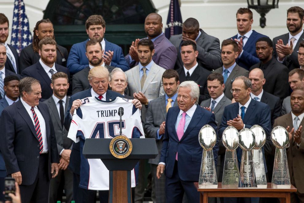 PHOTO: President Donald Trump is presented with a New England Patriots jersey by Patriots head coach Bill Belichick, left, and New England Patriots owner Robert Kraft, center, during a ceremony at the White House in Washington, Wednesday, April 19, 2017.