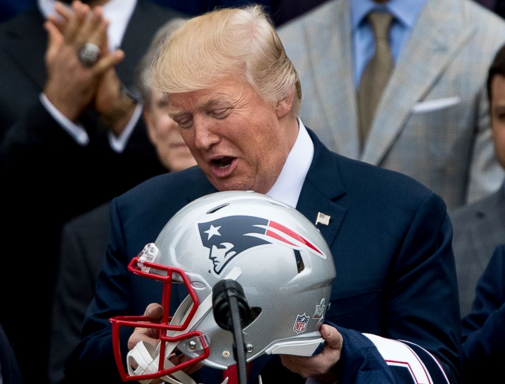 PHOTO: President Donald Trump is presented with a New England Patriots football helmet by Patriots head coach Bill Belichick and New England Patriots owner Robert Kraft during a ceremony at the White House in Washington, Wednesday, April 19, 2017.