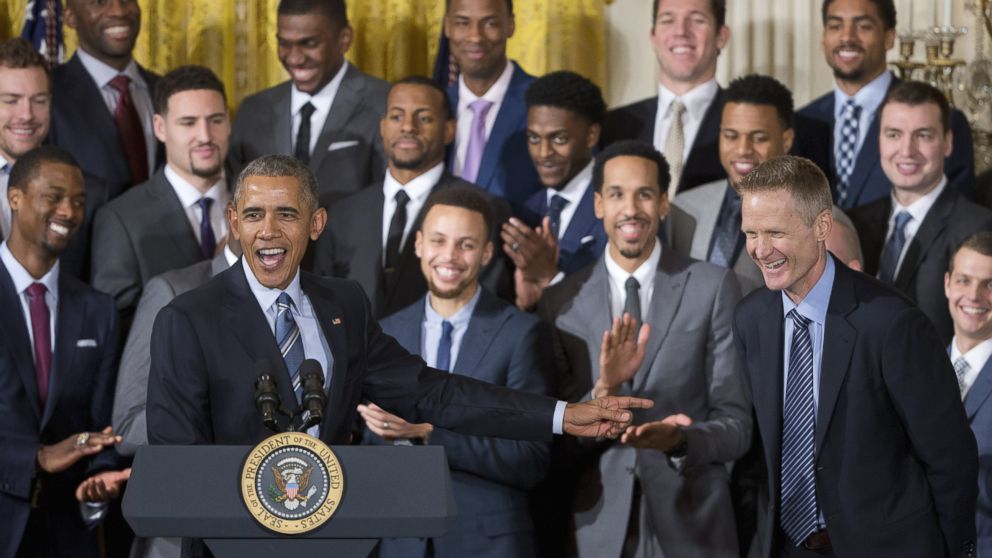 President Barack Obama points to Golden State Warriors head basketball coach Steve Kerr during a ceremony in the East Room of the White House in Washington, Feb. 4, 2016.