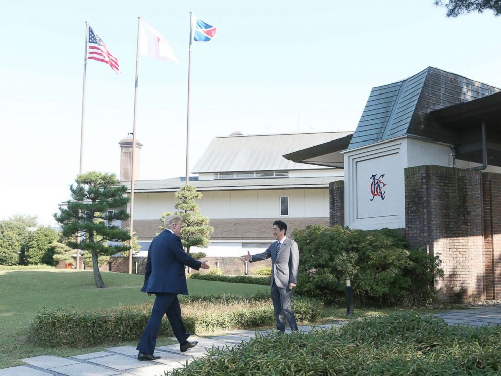 PHOTO: U.S. President Donald Trump (L) meets Japans Prime Minister Shinzo Abe at Kasumigaseki Country Club to play golf in Saitama Prefecture on Nov. 5, 2017. Trump came to Japan for the first time as a President, and will stay in Japan until Nov. 7th.