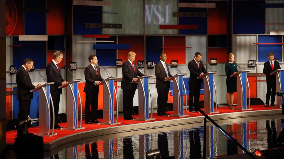 Republican presidential candidates John Kasich, Jeb Bush, Marco Rubio, Donald Trump, Ben Carson, Ted Cruz, Carly Fiorina and Rand Paul take the stage during Republican presidential debate at Milwaukee Theatre, Nov. 10, 2015, in Milwaukee. 