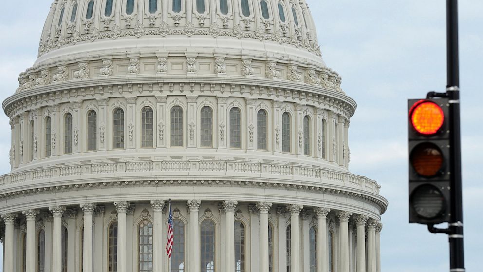 A stop light flashes near the Capitol in Washington, Oct. 1, 2013 as Congress plunged the nation into a partial government shutdown. 