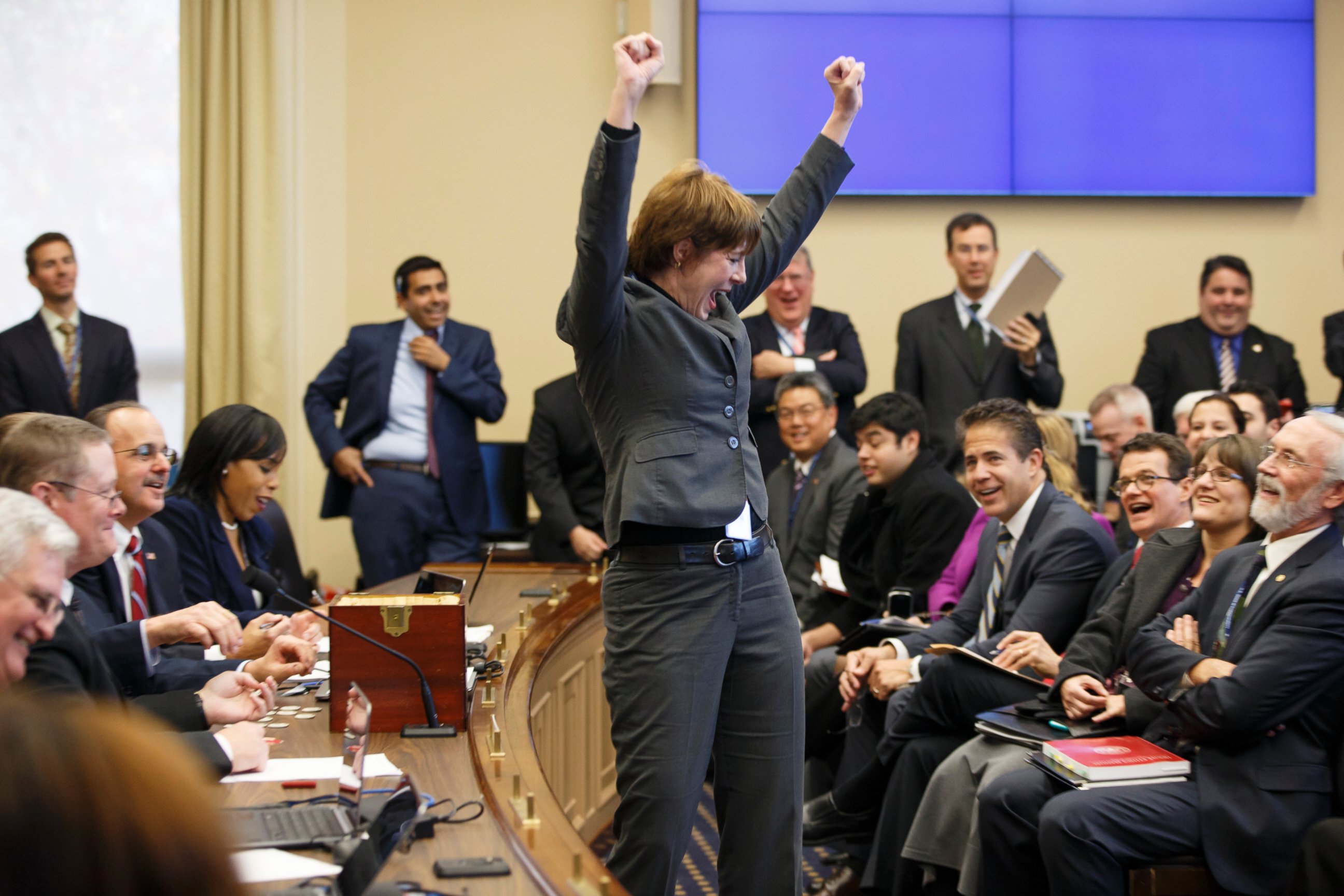 PHOTO: Representative-elect Gwen Graham raises her arms in jubilation after picking a favorable number in the office assignment lottery on Nov. 19, 2014, on Capitol Hill in Washington.