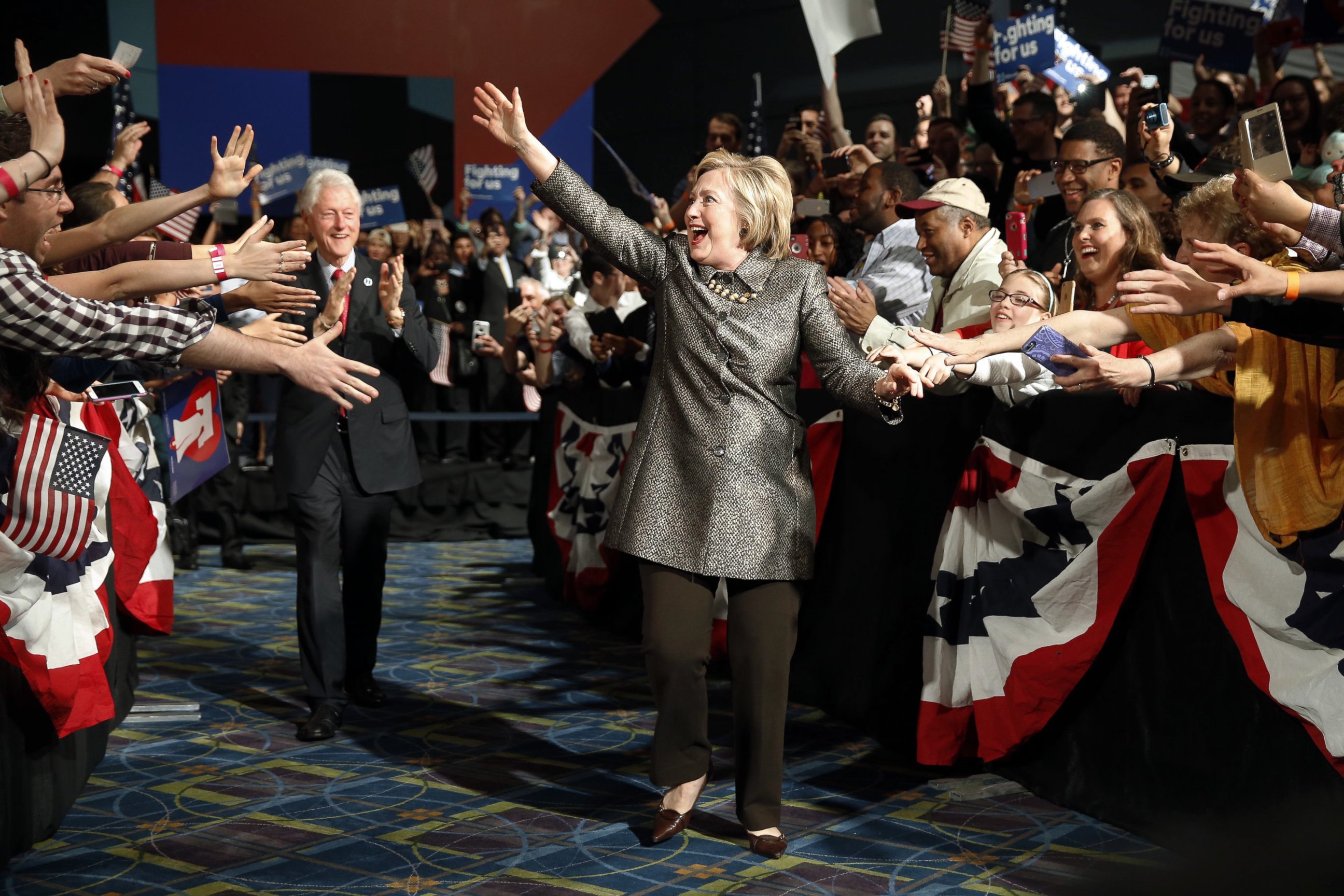 PHOTO: Democratic presidential candidate Hillary Clinton accompanied by former President Bill Clinton walks to stage at her presidential primary election night rally in Philadelphia on April 26, 2016.