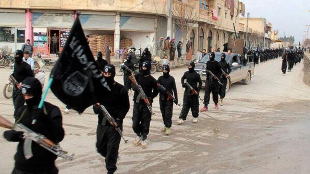 This undated photo posted on a militant website on Jan. 14, 2014, shows fighters from the al-Qaida linked Islamic State of Iraq and the Levant (ISIL) marching in Raqqa, Syria.