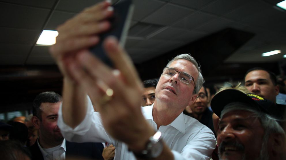 PHOTO: Former Florida Gov. Jeb Bush takes a selfie with a supporter's phone after holding a town hall meeting with Puerto Rico's Republican Party in Bayamon, Puerto Rico, April 28, 2015. 