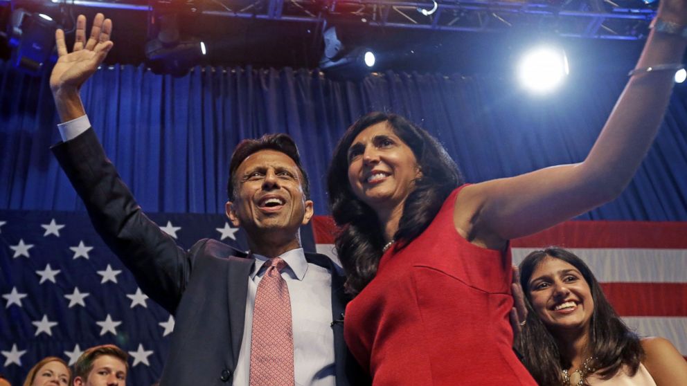 Louisiana Gov. Bobby Jindal waves to the crowd with his wife Supriya Jindal after he announced his candidacy for president in Kenner, La., June 24, 2015. 