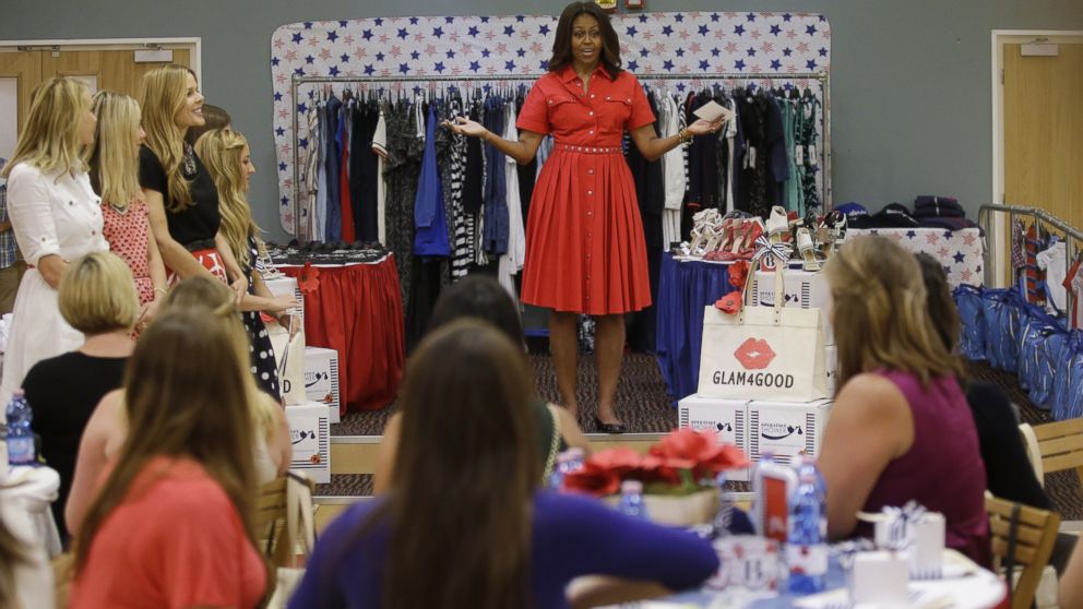 U.S. first lady Michelle Obama gives some expectant mothers clothes, shoes and other presents as she meets with soldiers and their families at the U.S. Army Garrison Vicenza, northern Italy, June 19, 2015. 