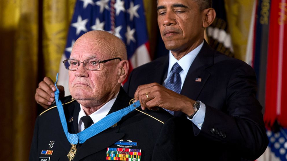 President Barack Obama bestows the Medal of Honor on retired Army Command Sgt. Maj. Bennie G. Adkins in the East Room of the White House in Washington, Sept. 15, 2014.
