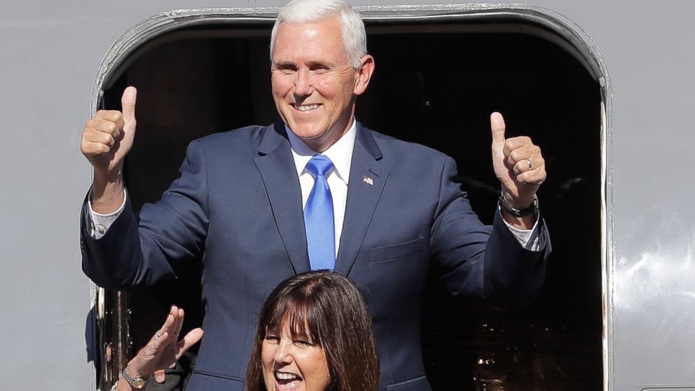 Indiana Gov. Mike Pence reacts with his wife, Karen, as they arrive for a Welcome Home Rally, Saturday, July 16, 2016, in Zionsville, Ind. Republican presidential candidate Donald Trump announced Pence as his vice presidential running mate. 