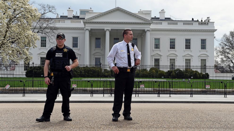 Members of the Secret Service stand on Pennsylvania Avenue outside the White House in Washington, April 7, 2015.