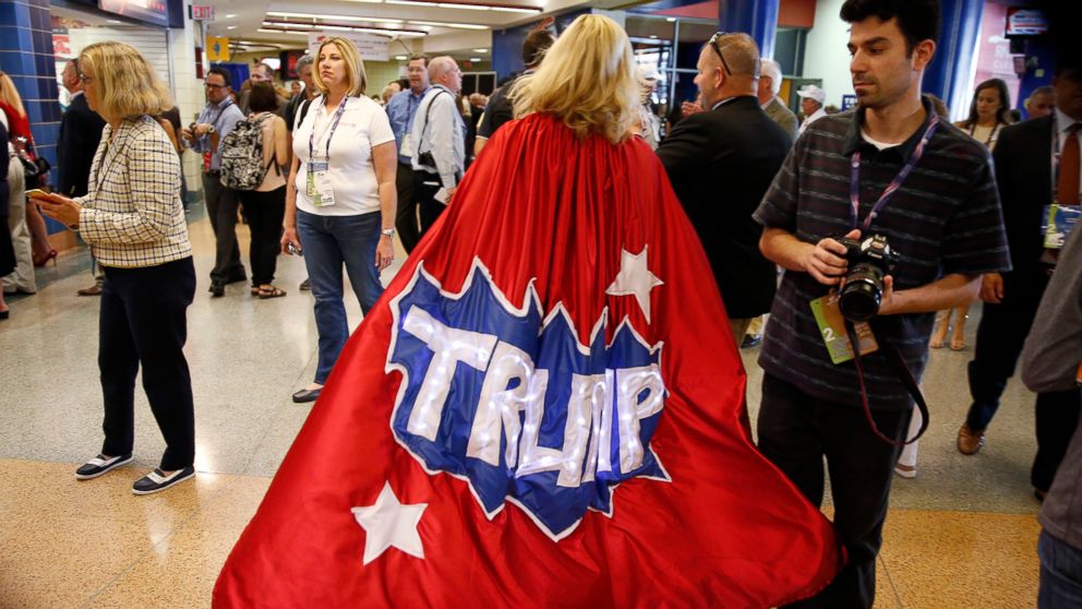 Minnesota delegate Mary Susan walks down the hallway in her Trump cape at Quicken Loans Arena before the start of the second day session of the Republican National Convention in Cleveland, July 19, 2016. 