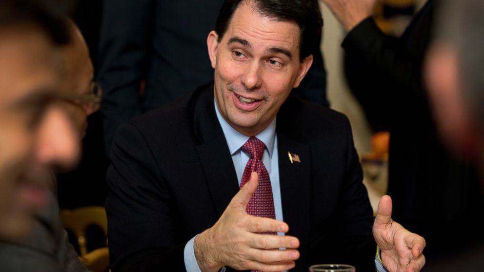 Wisconsin Gov. Scott Walker is seen in this Feb. 23, 2015 file photo at his table before President Barack Obama arrived to speaks to members of the National Governors Association in Washington. 
