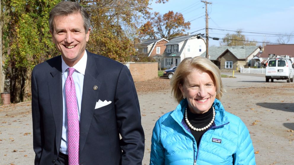 Shelley Moore Capito and her husband Charlie Capito head to their polling place to vote on Nov. 4, 2014 in the South Hills neighborhood of Charleston, W.Va.