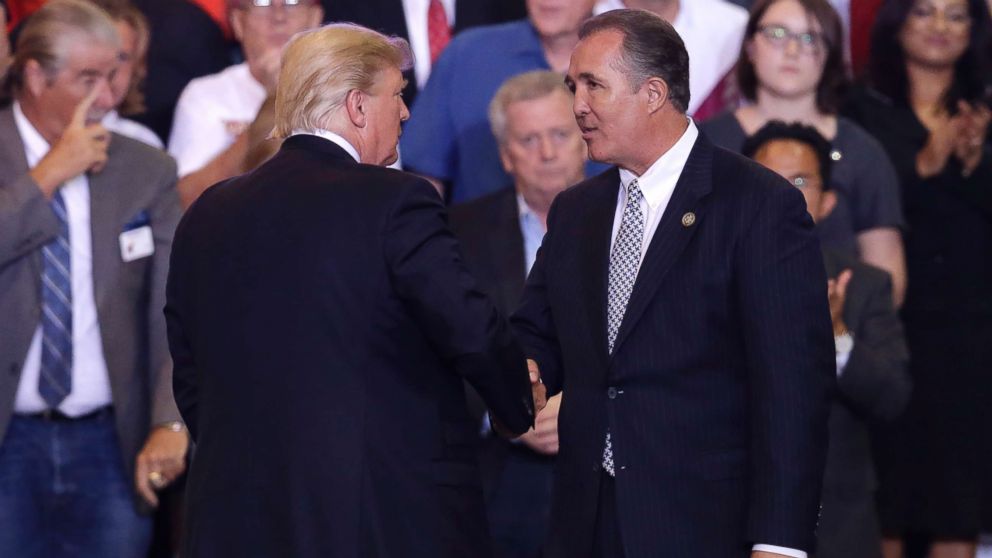 PHOTO: President Donald Trump shakes hands with Arizona Representative Trent Franks during a rally at the Phoenix Convention Center, Tuesday, Aug. 22, 2017, in Phoenix. 