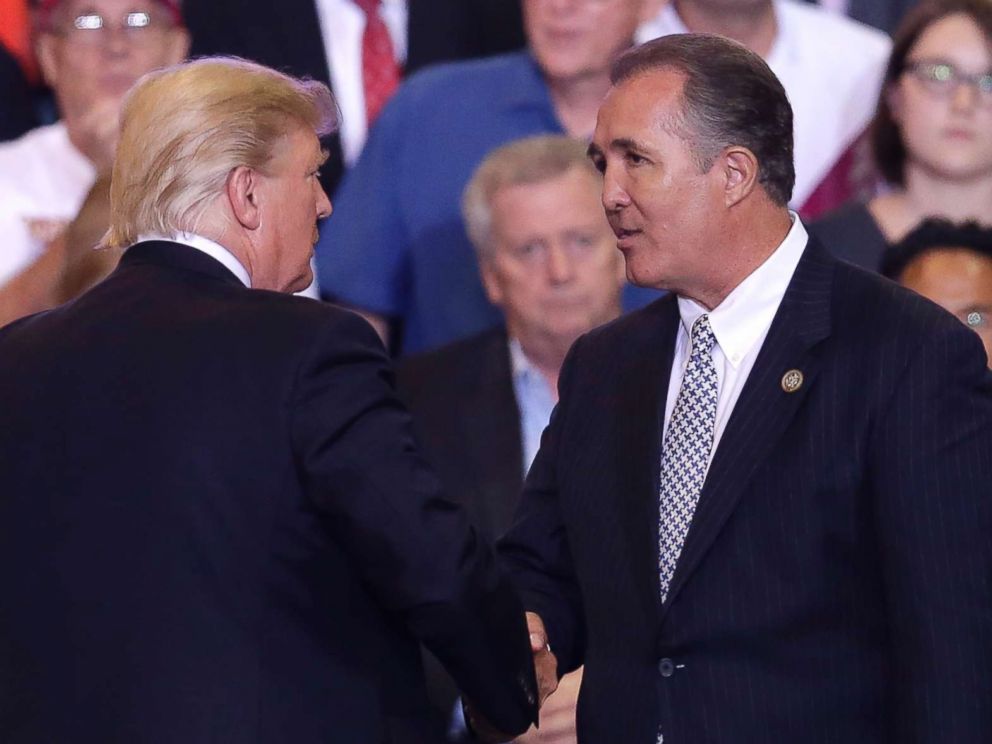 PHOTO: President Donald Trump shakes hands with Arizona Representative Trent Franks during a rally at the Phoenix Convention Center, Tuesday, Aug. 22, 2017, in Phoenix. 