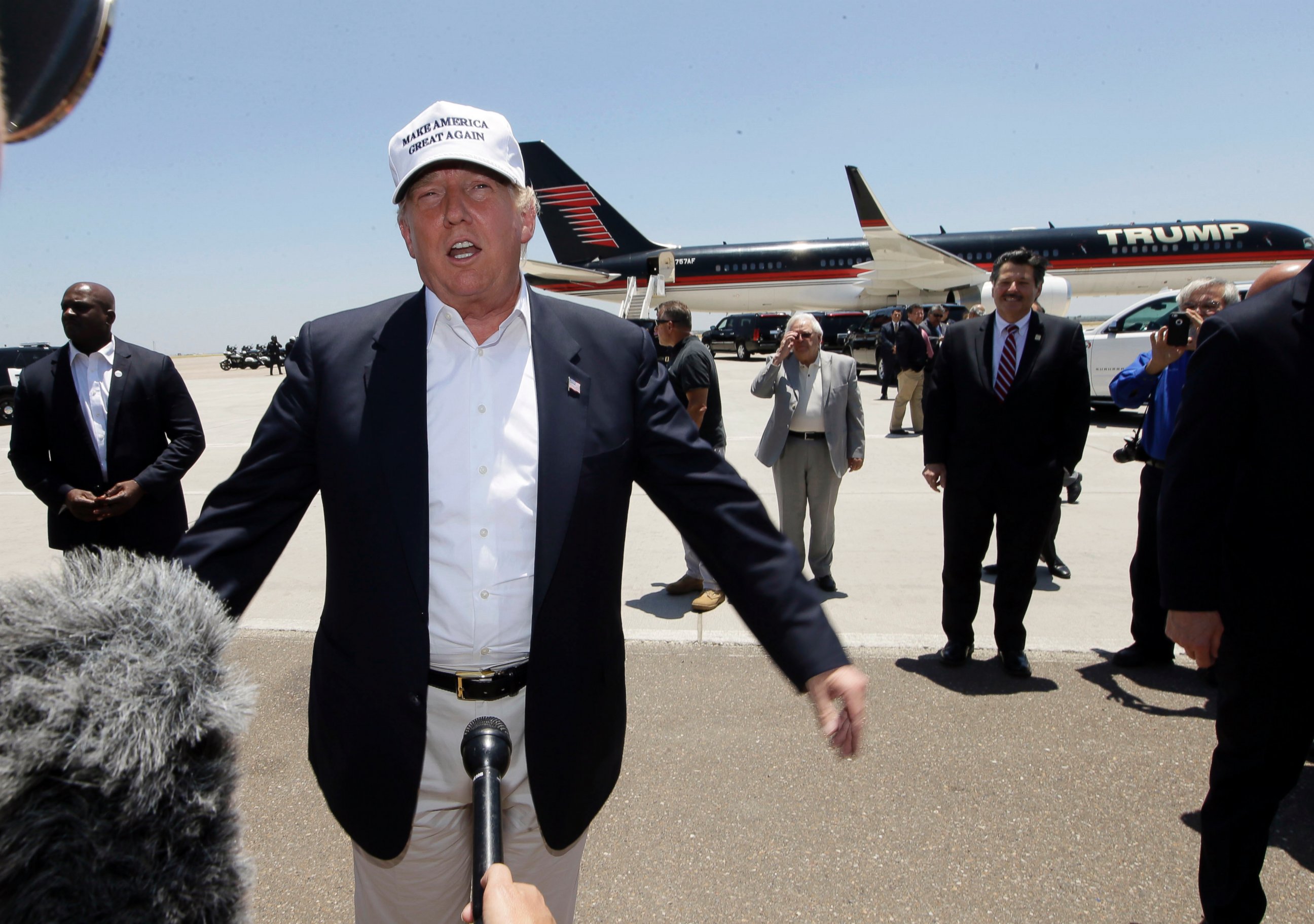 PHOTO: Republican presidential hopeful Donald Trump speaks after arriving at the airport for a visit to the U.S. Mexico border in Laredo, Texas, July 23, 2015. 