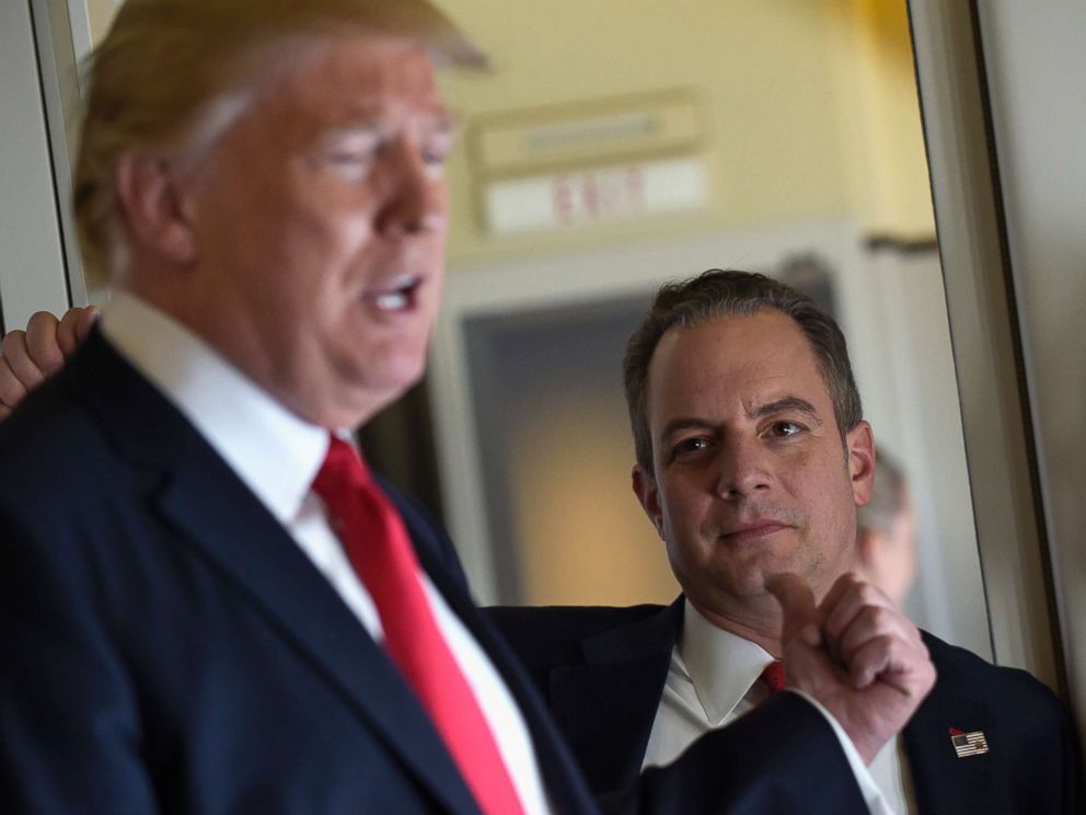 PHOTO: Then-White House Chief of Staff Reince Priebus listens at right as President Donald Trump speaks to reporters on Air Force One while traveling to Palm Beach International Airport in West Palm Beach, Fla., Friday, Feb. 3, 2017.