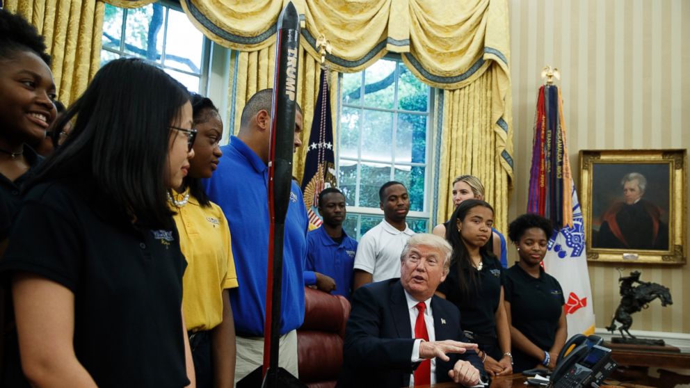 President Donald Trump speaks to members of the rocket team from Victory Christian Center School in Charlotte, N.C., Friday, May 12, 2017, in the Oval Office of the White House in Washington. 