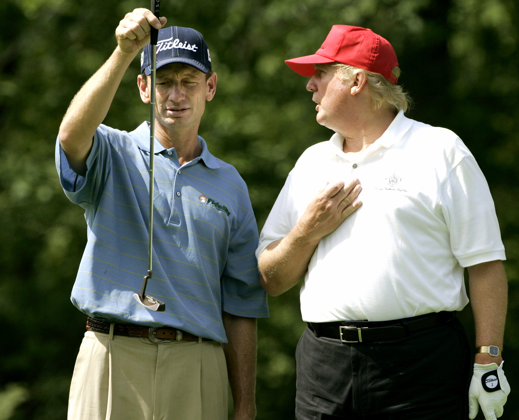 PHOTO: Brad Faxon, left, lines up a putt while listening to Donald Trump, right, on the fifth green during a Pro-Am round at the Deutsche Bank Championship golf tournament at the TPC of Boston in Norton, Mass., Thursday Aug. 31, 2006.