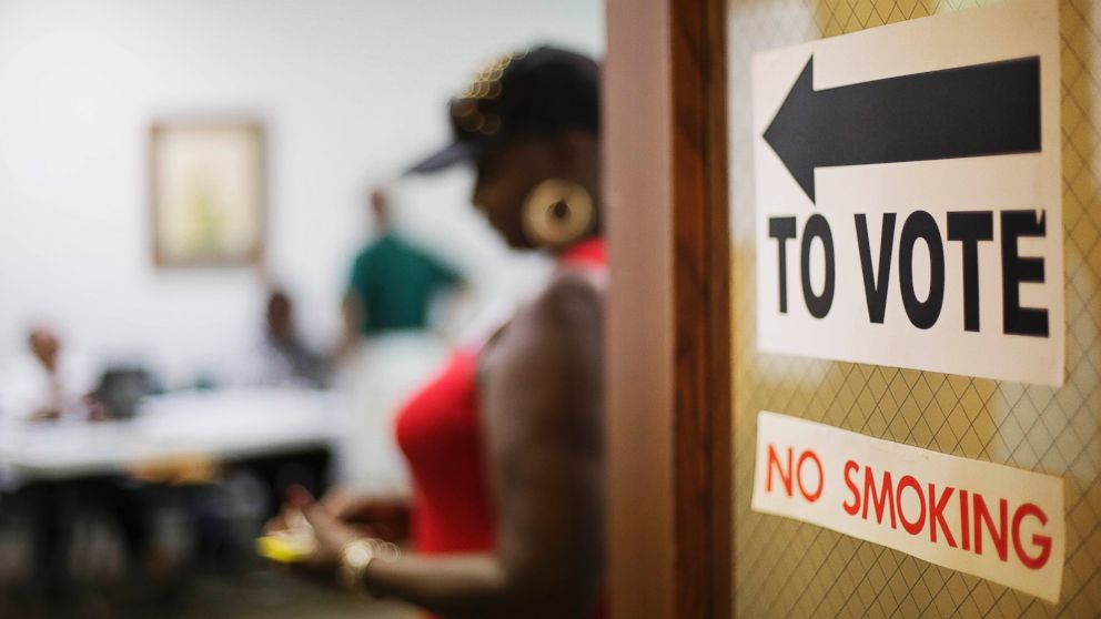 A sign directs voters at a polling site in Atlanta, Georgia, July 22, 2014.