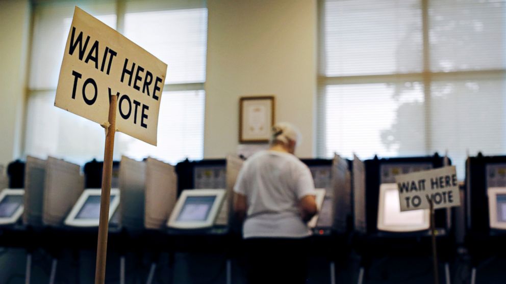 A sign greets voters before they step up to cast their ballot at a polling site in Atlanta, Georgia, July 22, 2014.