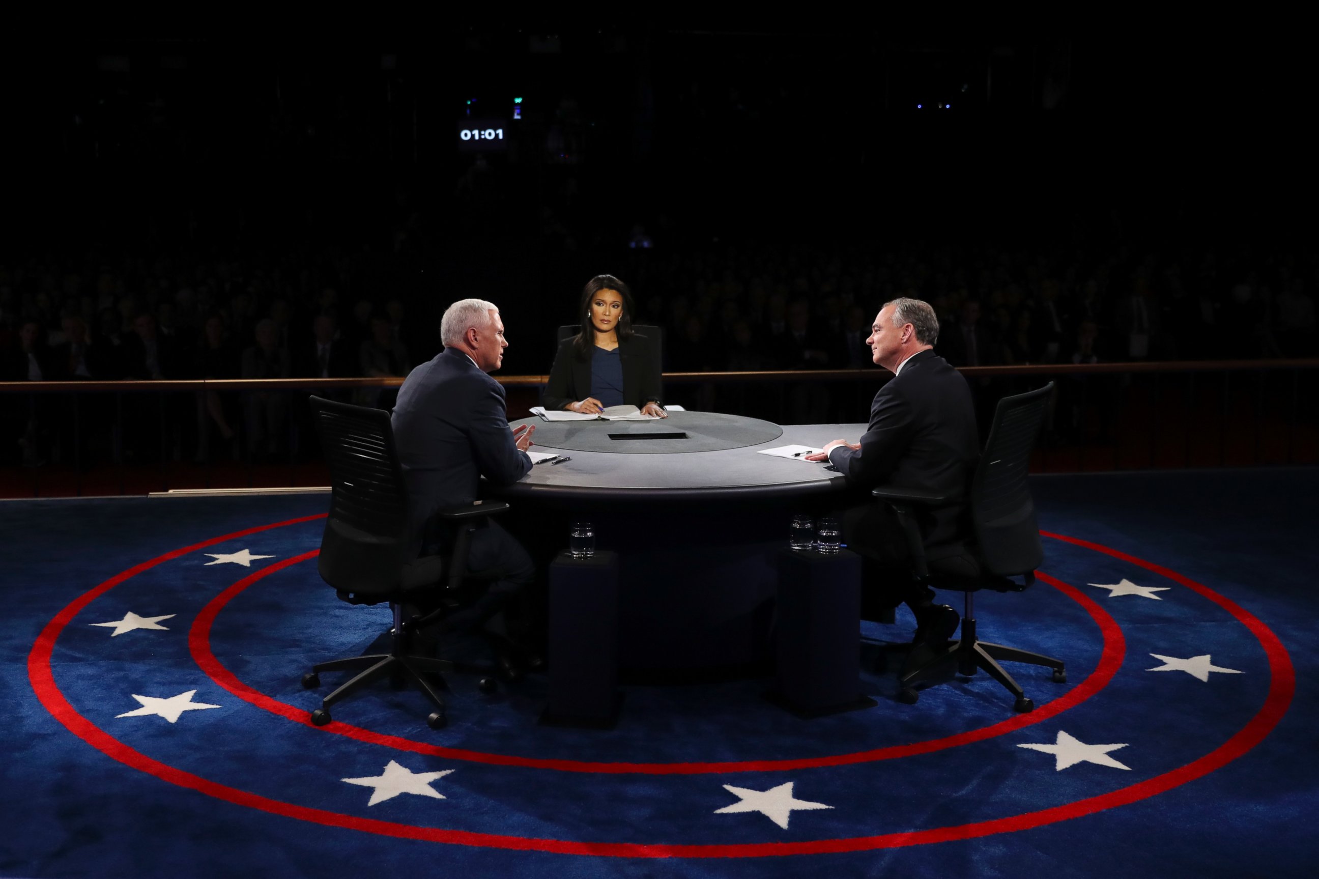 PHOTO: Republican vice-presidential nominee Gov. Mike Pence and Democratic vice-presidential nominee Sen. Tim Kaine discuss as Moderator Elaine Quijano listens during the vice-presidential debate at Longwood University in Farmville, Va., Oct. 4, 2016.