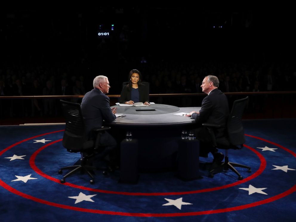 PHOTO: Republican vice-presidential nominee Gov. Mike Pence and Democratic vice-presidential nominee Sen. Tim Kaine discuss as Moderator Elaine Quijano listens during the vice-presidential debate at Longwood University in Farmville, Va., Oct. 4, 2016.