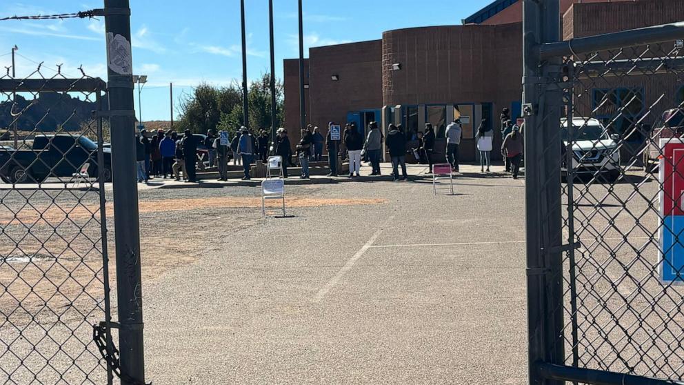 PHOTO: Navajo voters wait to vote outside of the Fort Defiance Chapter House in Apache County where voting issues persist on Nov. 5, 2024.